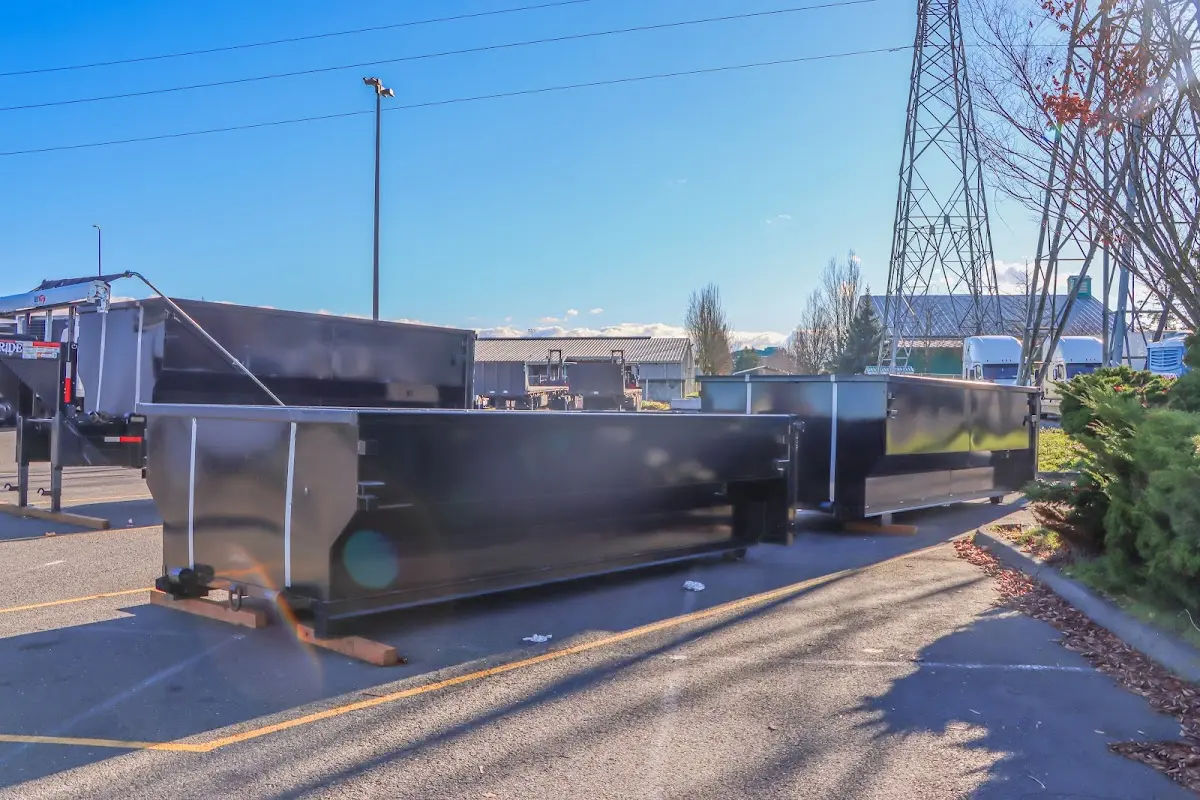 Roll-off dumpster ready for waste disposal at job site for Roofing Dumpster Rental in Manchester-by-the-Sea